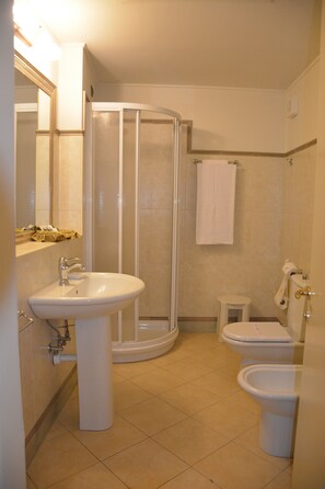 Hair dryer, slippers, bidet, towels