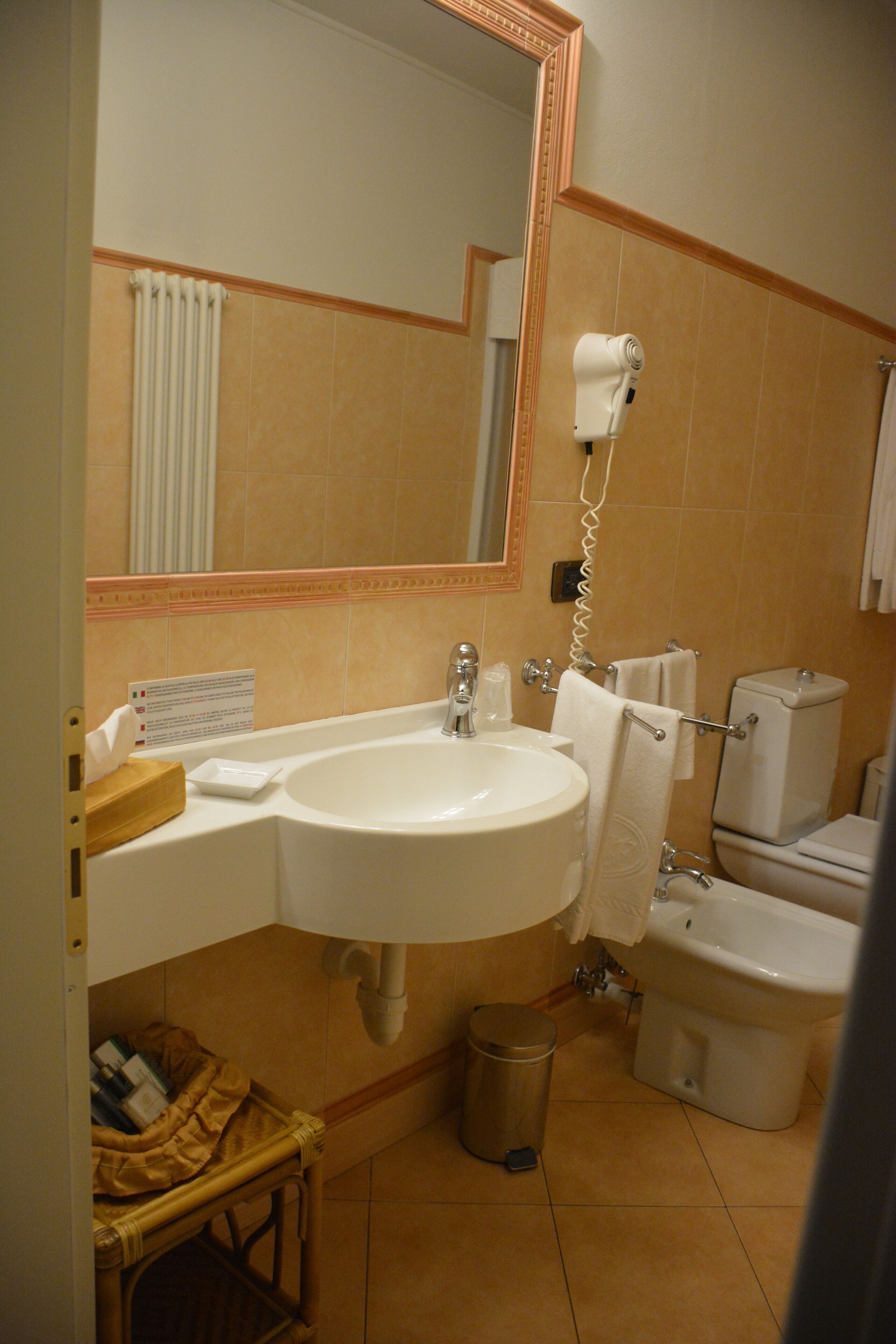 classic triple room | bathroom | hair dryer, slippers, bidet, towels