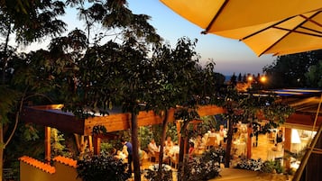 Breakfast, dinner served; local cuisine, garden views