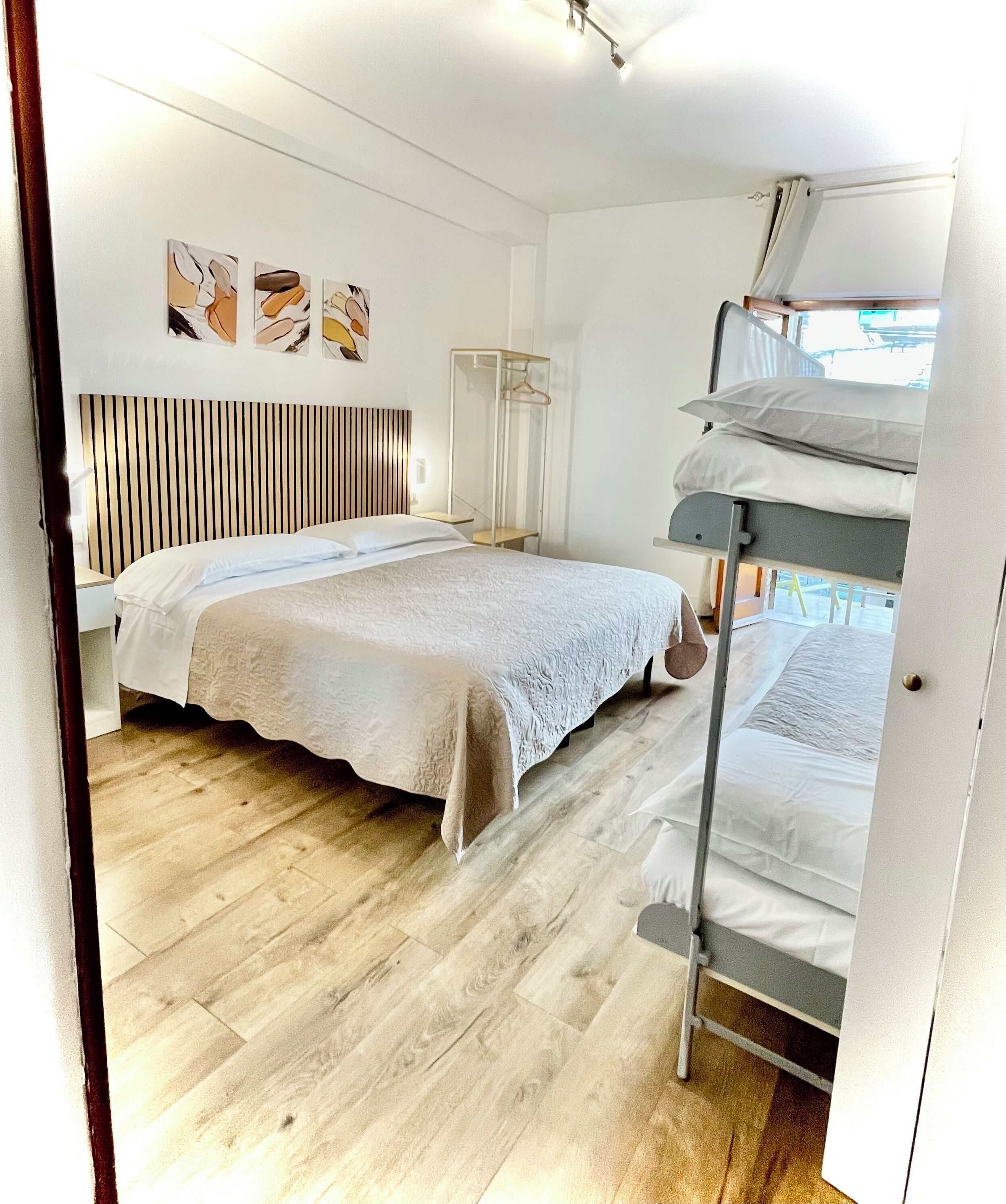 Quadruple Room | Minibar, individually decorated, individually furnished, desk