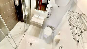Shower, hair dryer, towels, soap