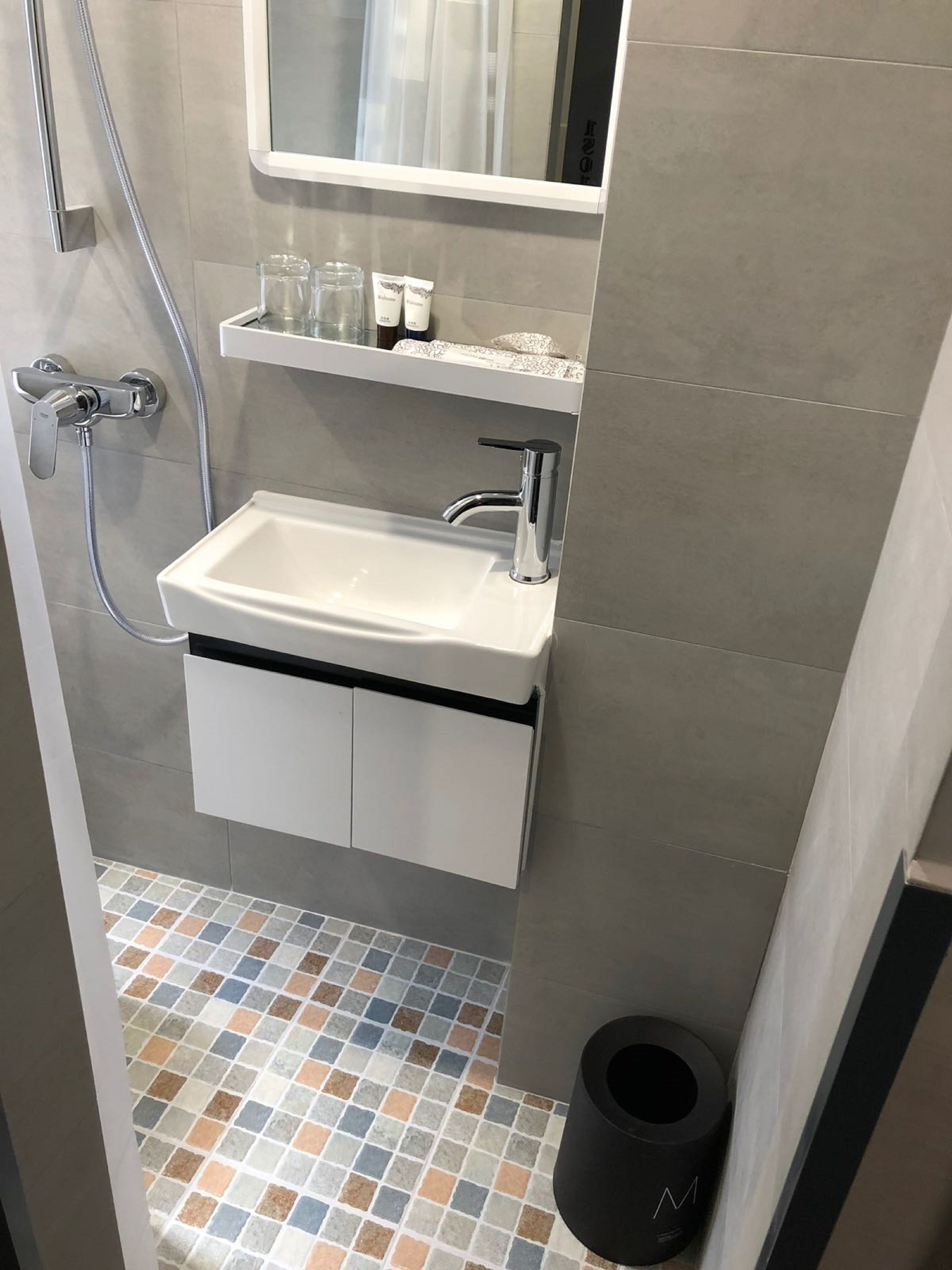 Shower, hair dryer, slippers, towels