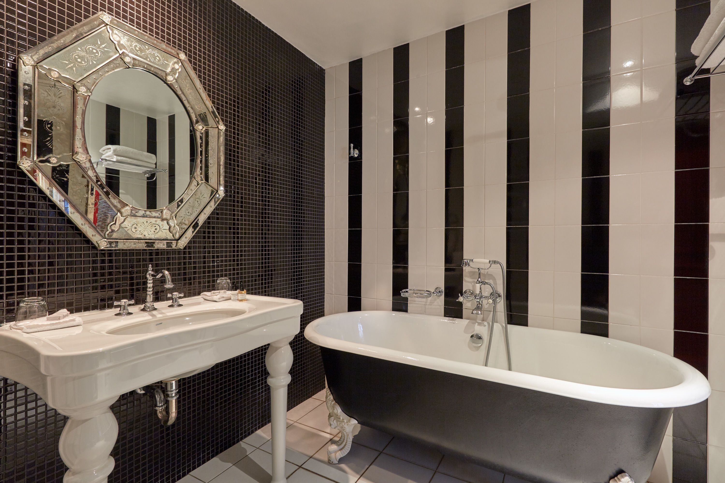 deluxe room | bathroom | designer toiletries, hair dryer, bathrobes, slippers