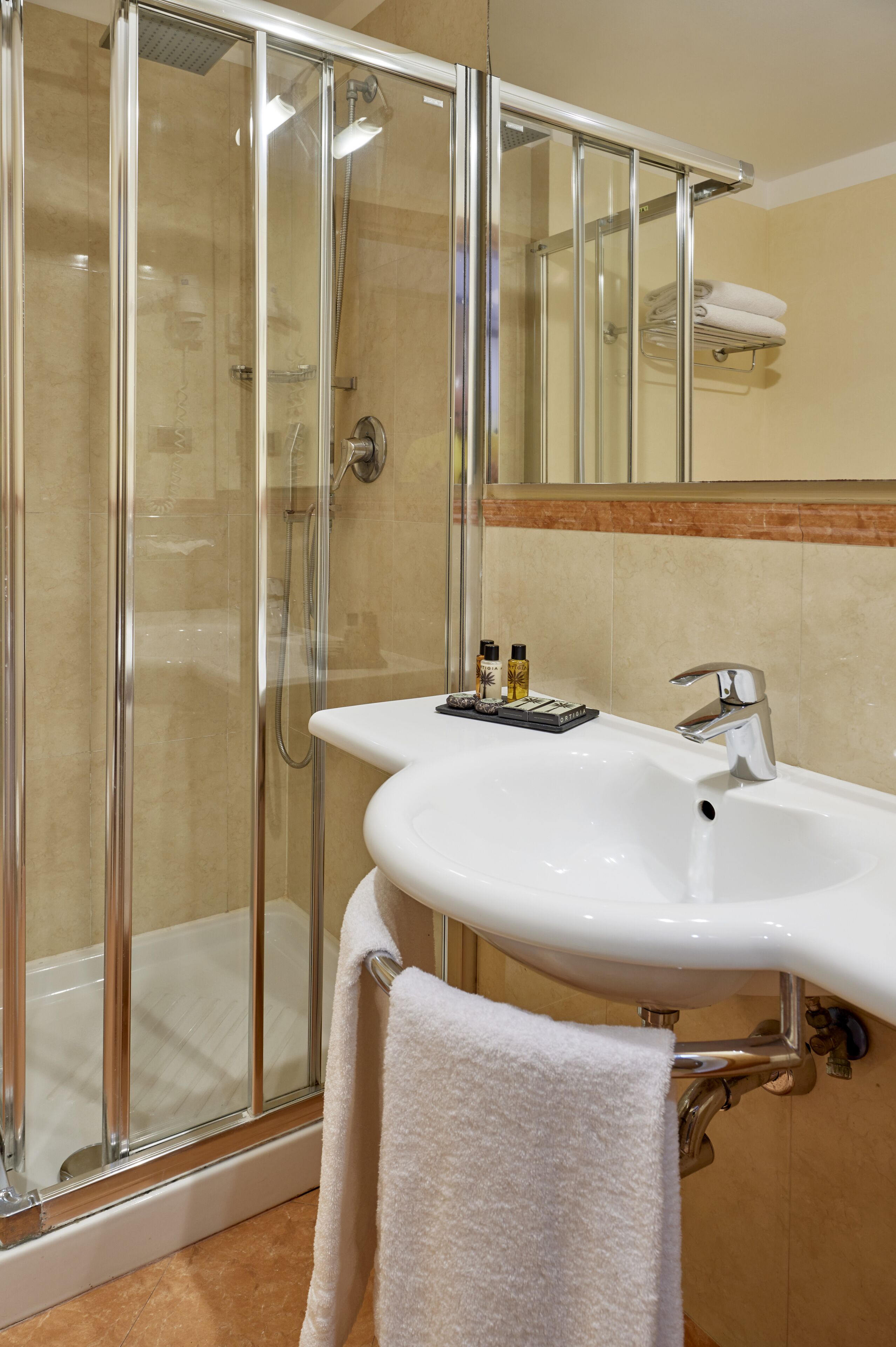 shower, free toiletries, hair dryer, towels