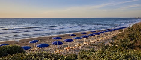 On the beach, beach umbrellas, beach towels