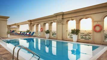 Outdoor pool, open 8:00 AM to 9:00 PM, pool umbrellas, sun loungers