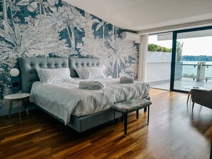 Panoramic Suite, Balcony, Lake View | Minibar, in-room safe, individually furnished, desk