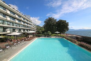 Outdoor pool, open 9 AM to 6 PM, pool umbrellas, sun loungers