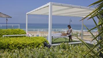 Relax and rejuvenate with ocean views and a serene massage therapy area.