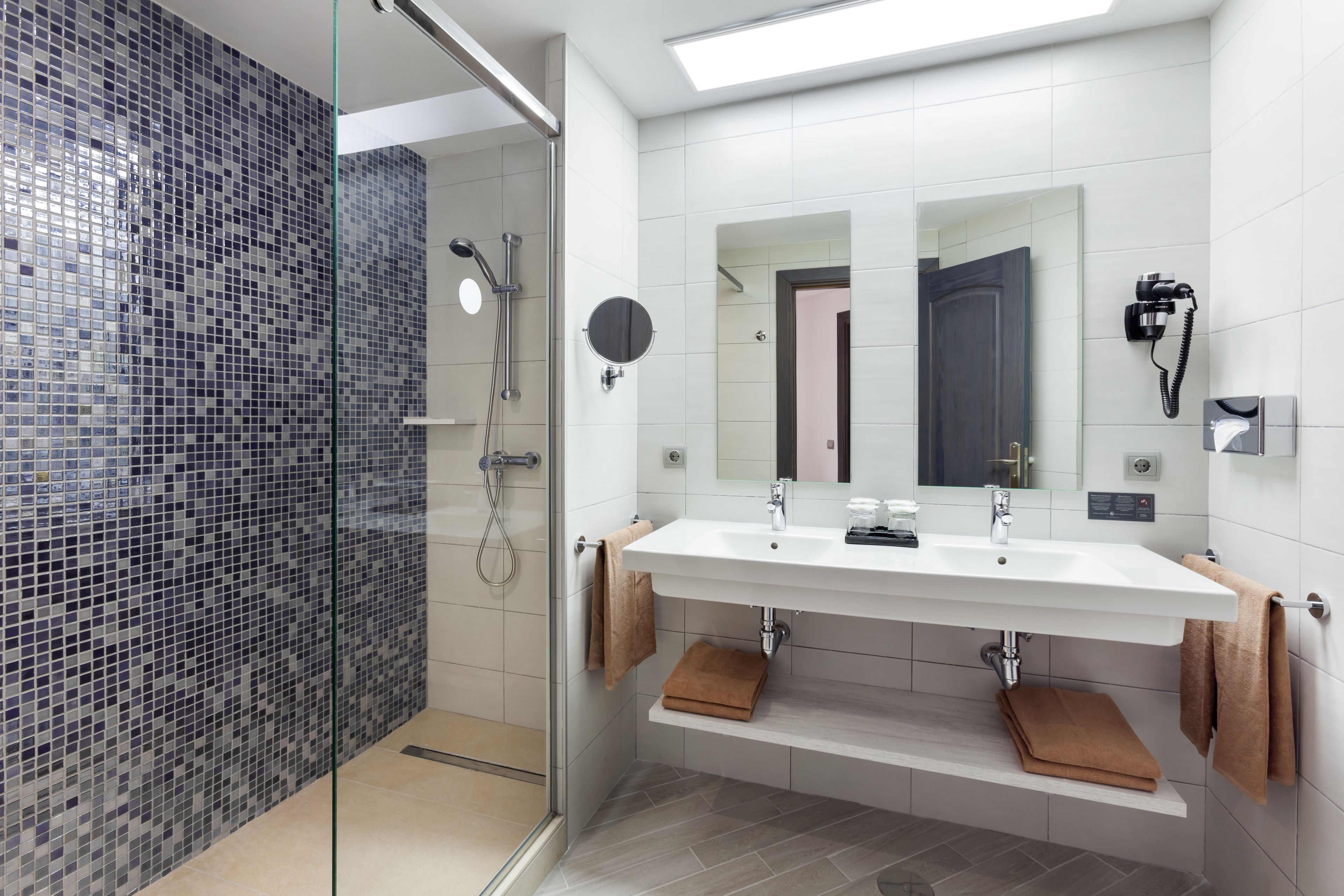 shower, eco-friendly toiletries, hair dryer, towels