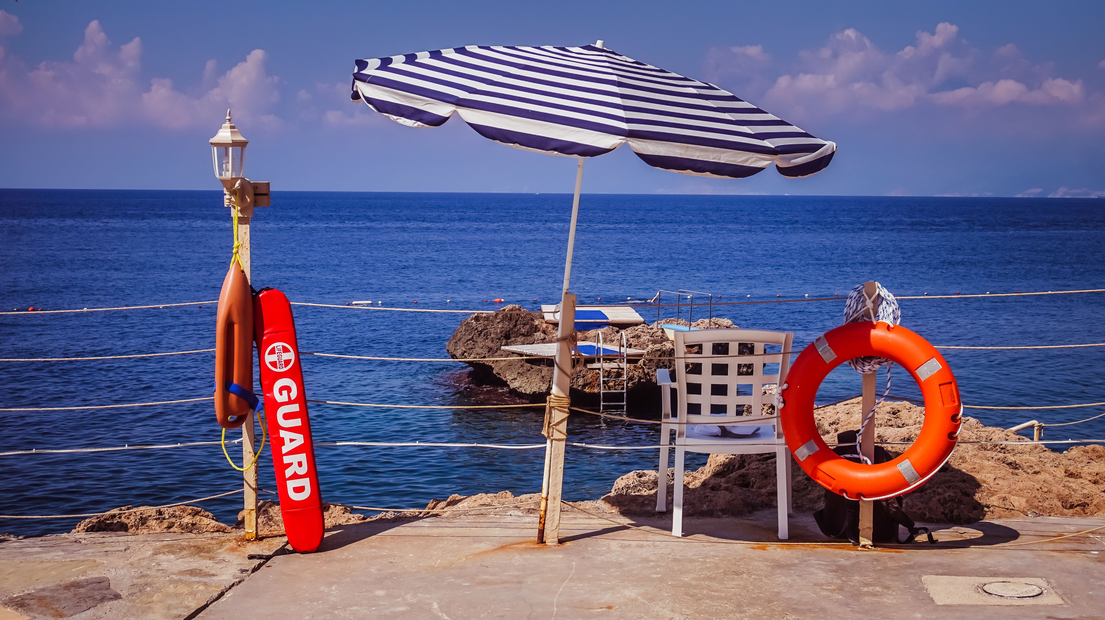 on the beach, sun-loungers, beach umbrellas, beach towels
