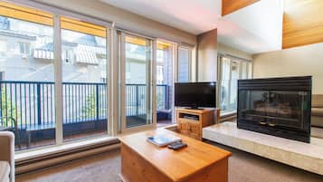 Condo, 1 Bedroom + Loft, Hot Tub (Unit 205) | Living area | 50-inch Smart TV with cable channels, fireplace