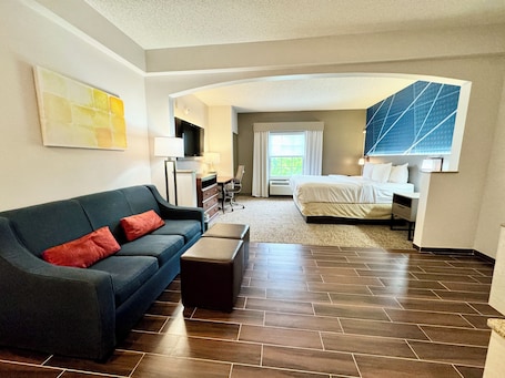 Suite, 1 King Bed, Non Smoking, Jetted Tub | Desk, laptop workspace, blackout drapes, iron/ironing board