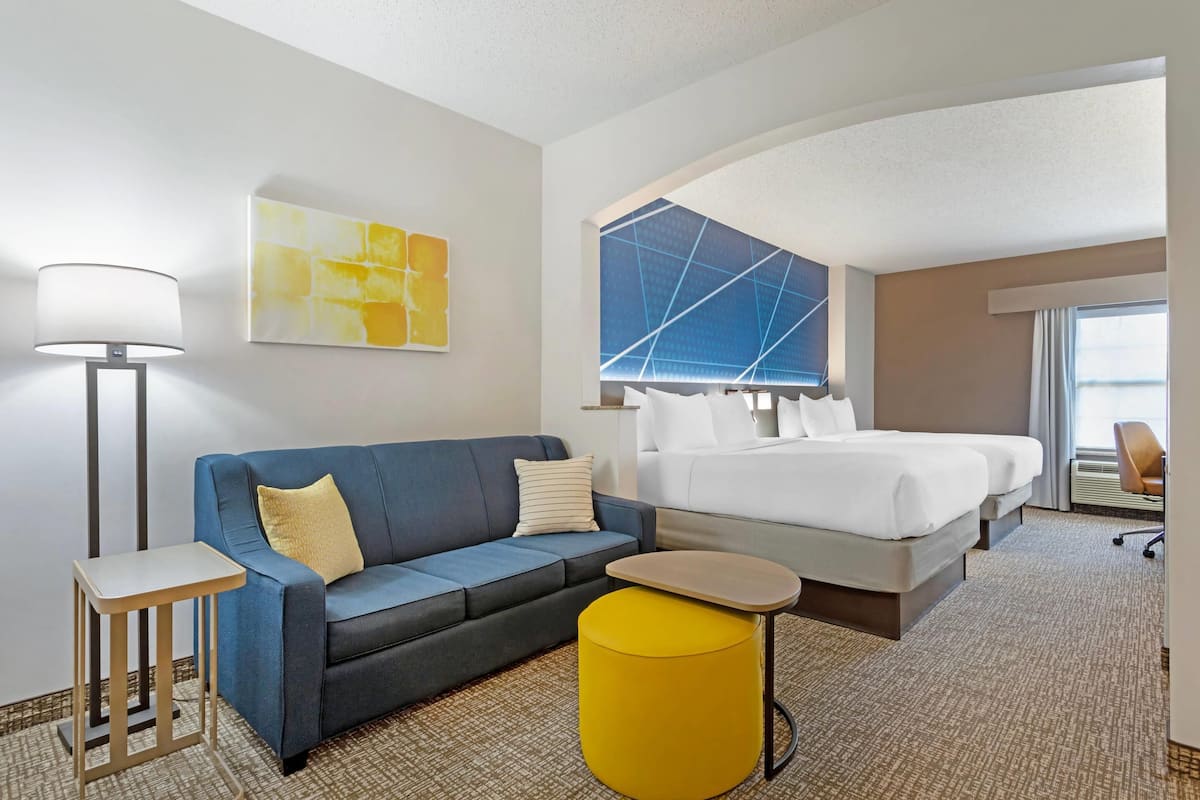 Suite, 2 Queen Beds, Non Smoking | Desk, laptop workspace, blackout drapes, iron/ironing board