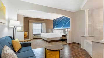 Suite, 1 King Bed, Non Smoking, Jetted Tub | Desk, laptop workspace, blackout drapes, iron/ironing board