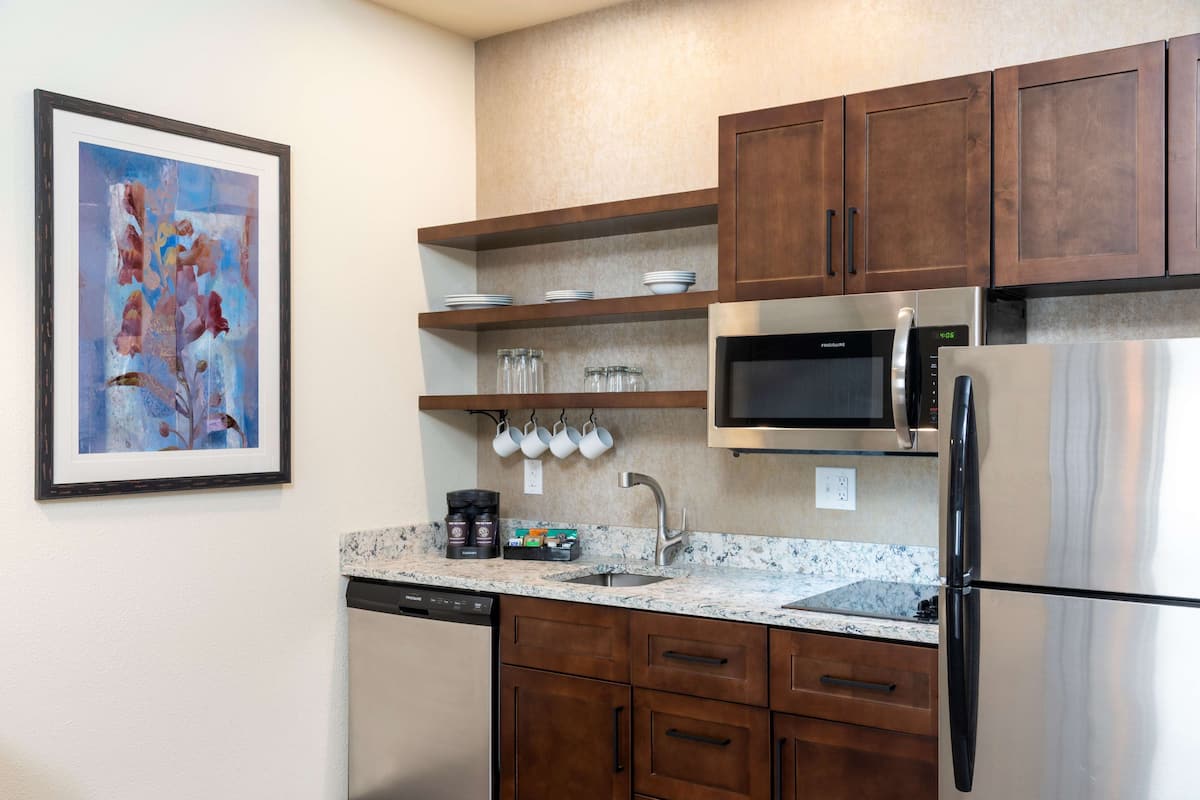 full-sized fridge, microwave, stovetop, dishwasher