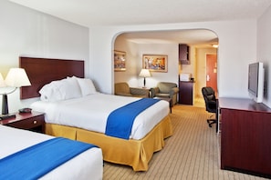 A hotel room with a large bed, a desk, a chair, a TV, and artwork on the walls. - Holiday Inn Express Hotel & Suites Bremen by IHG (Bremen)