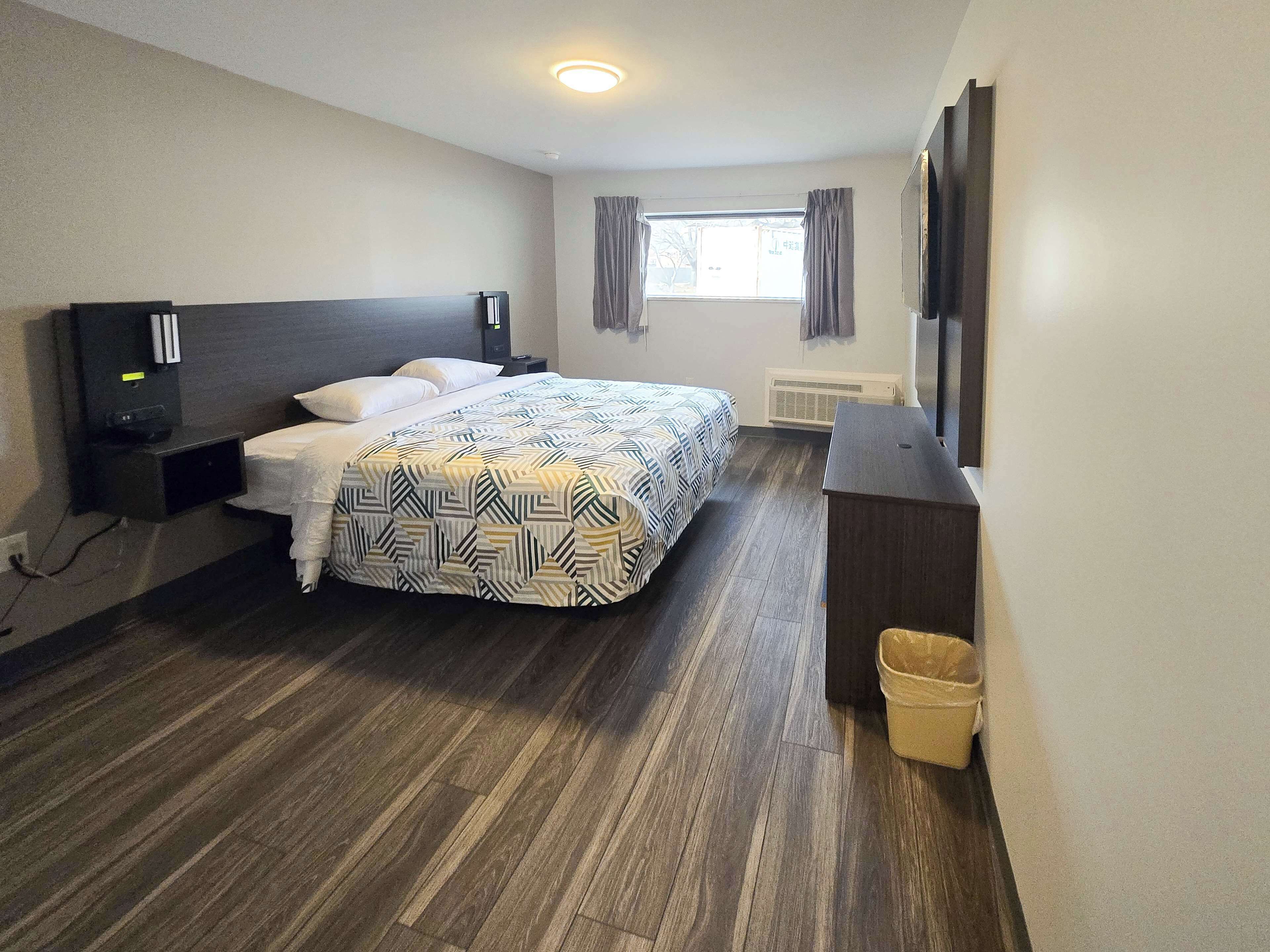 Premium bedding, down comforters, blackout drapes, free WiFi