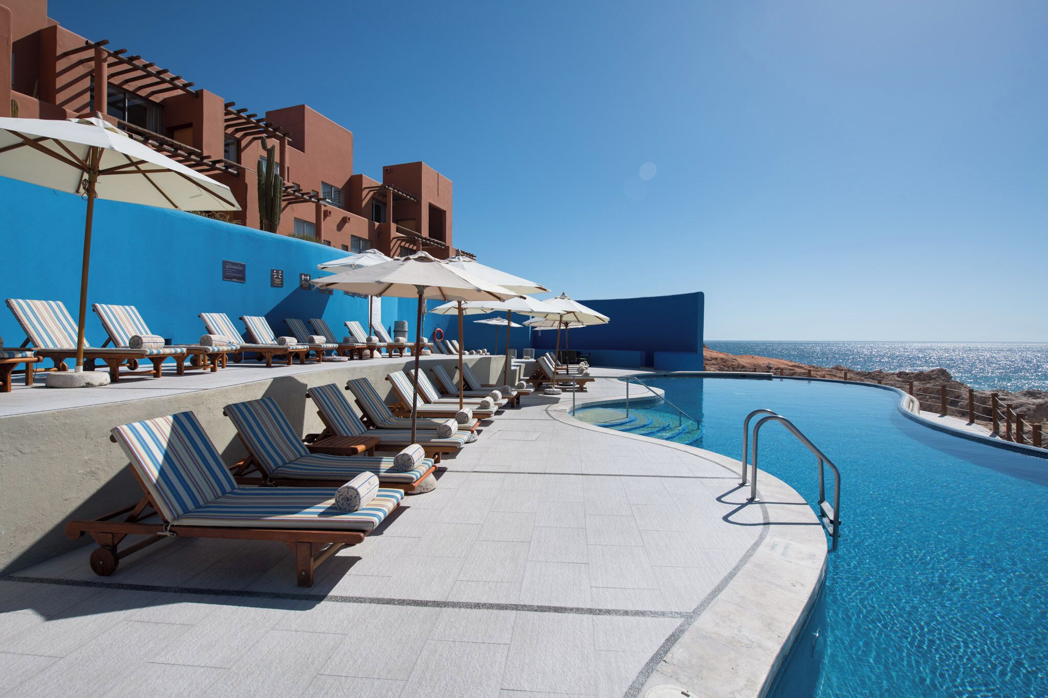 4 outdoor pools, open 8:00 am to 9:00 pm, pool umbrellas, pool loungers