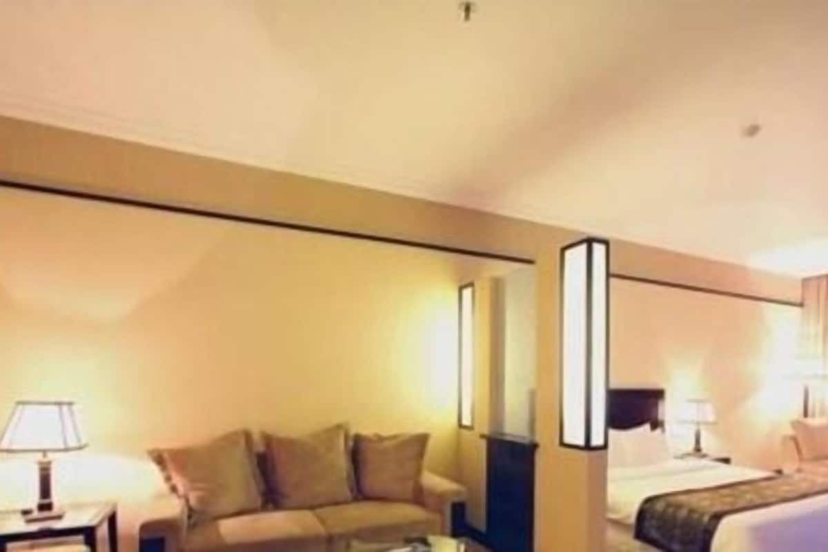 Habitación ejecutiva | Área de sala de estar | Televisión 