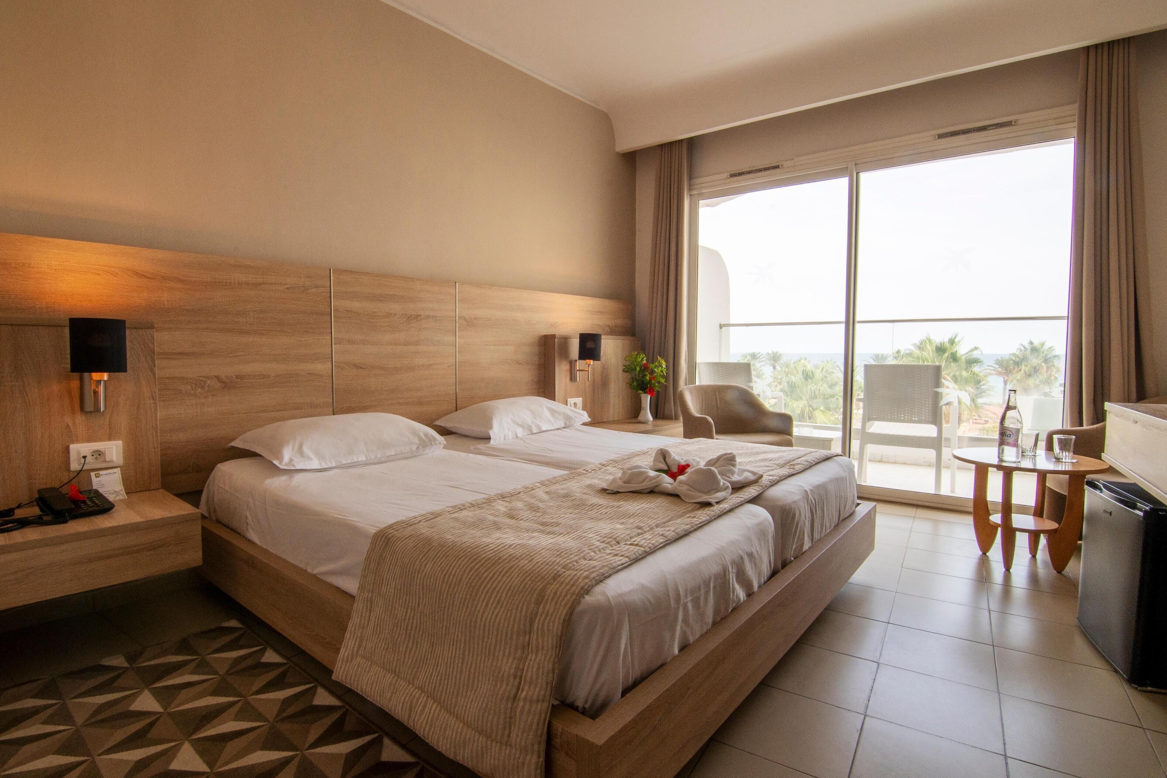 Standard Double Room, Sea View | Minibar, in-room safe, blackout drapes, free WiFi