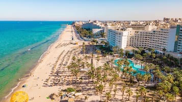 Private beach, white sand, sun loungers, beach umbrellas