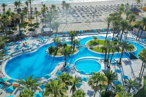 Indoor pool, outdoor pool, open 9:00 AM to 5:00 PM, pool umbrellas