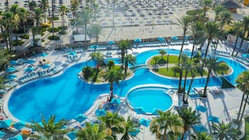 Indoor pool, outdoor pool, open 9:00 AM to 5:00 PM, pool umbrellas
