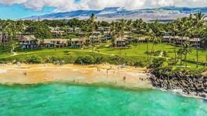 A resort with multiple buildings, a golf course, and a beach. - Wailea Elua- CoralTree Residence Collection (Kihei)