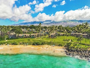A resort with multiple buildings, a golf course, and a beach. - Wailea Elua- CoralTree Residence Collection (Kihei)