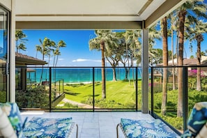 A balcony with a view of the ocean and palm trees. - Wailea Elua- CoralTree Residence Collection (Kihei)