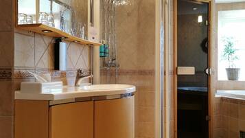 Suite, 1 King Bed, Non Smoking, Jetted Tub | Bathroom | Shower, towels, soap, shampoo