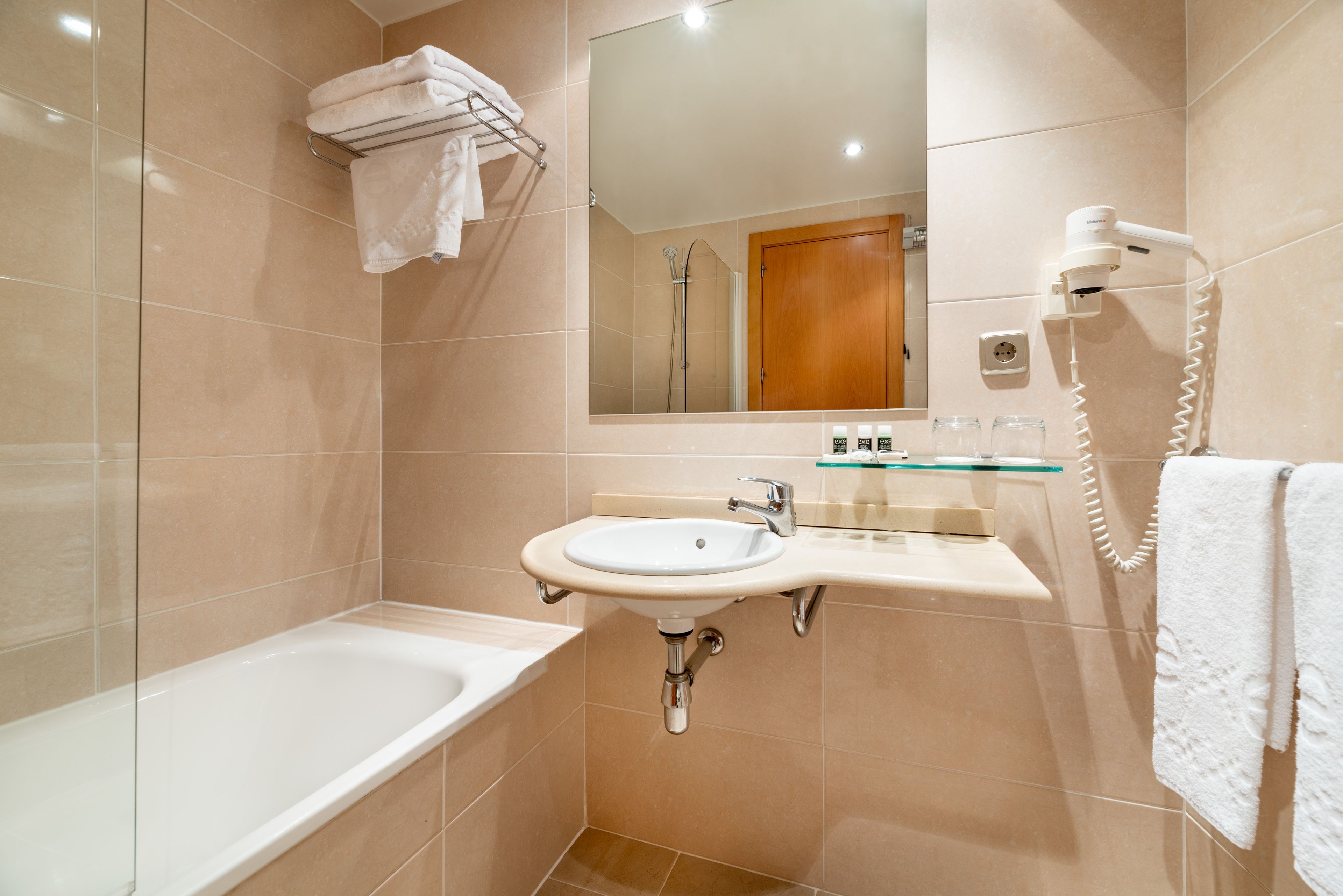 eco-friendly toiletries, hair dryer, towels, soap