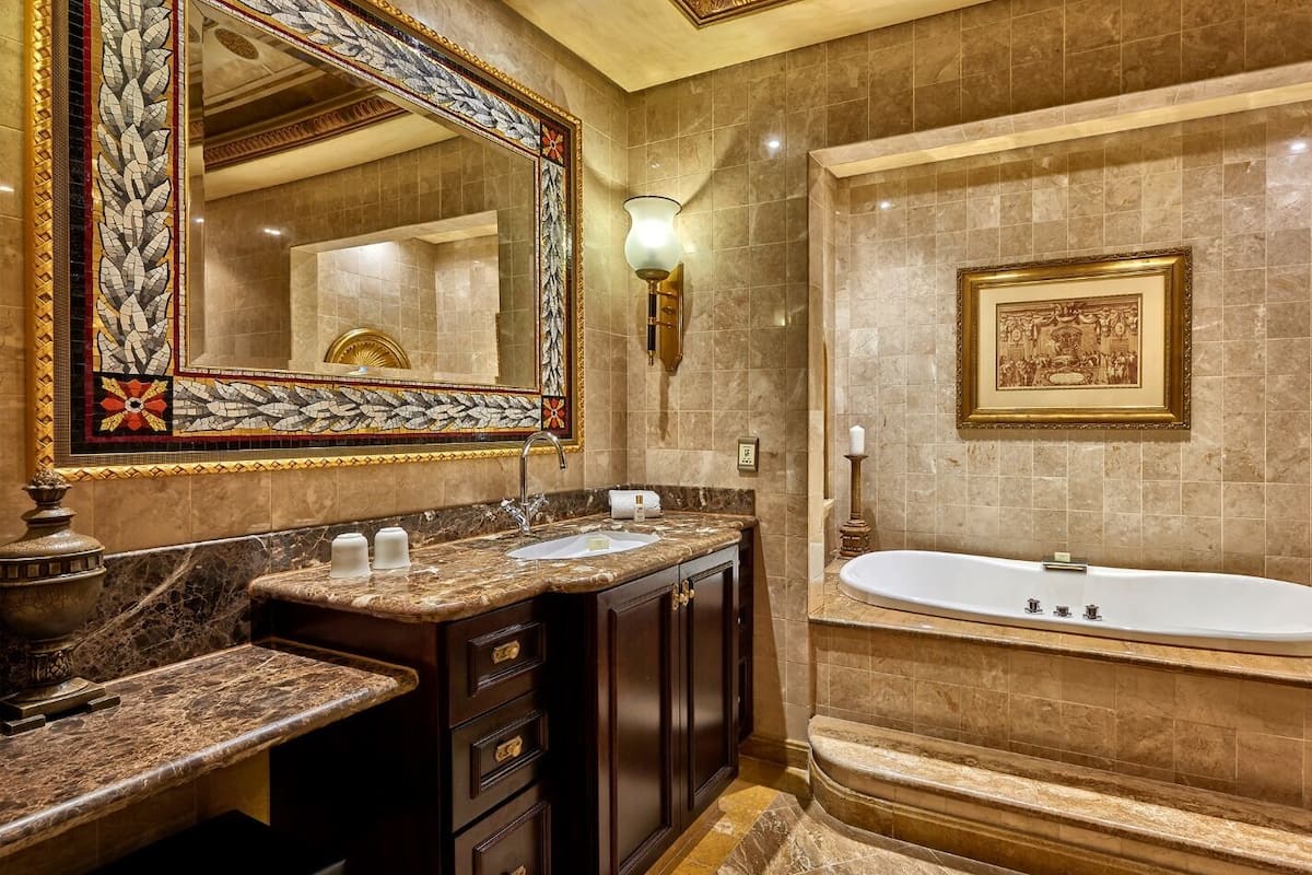 presidential suite (club floor) | bathroom | combined shower/bathtub, designer toiletries, hair dryer, slippers