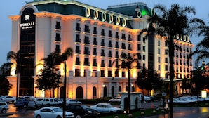 A large, multi-story hotel with a classic architectural style, featuring a prominent sign and multiple balconies. - Peermont D'oreale Grande at Emperors Palace (Kempton Park)