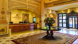 A grand lobby with a chandelier, a reception desk, and a large floral arrangement. - Peermont D'oreale Grande at Emperors Palace (Kempton Park)