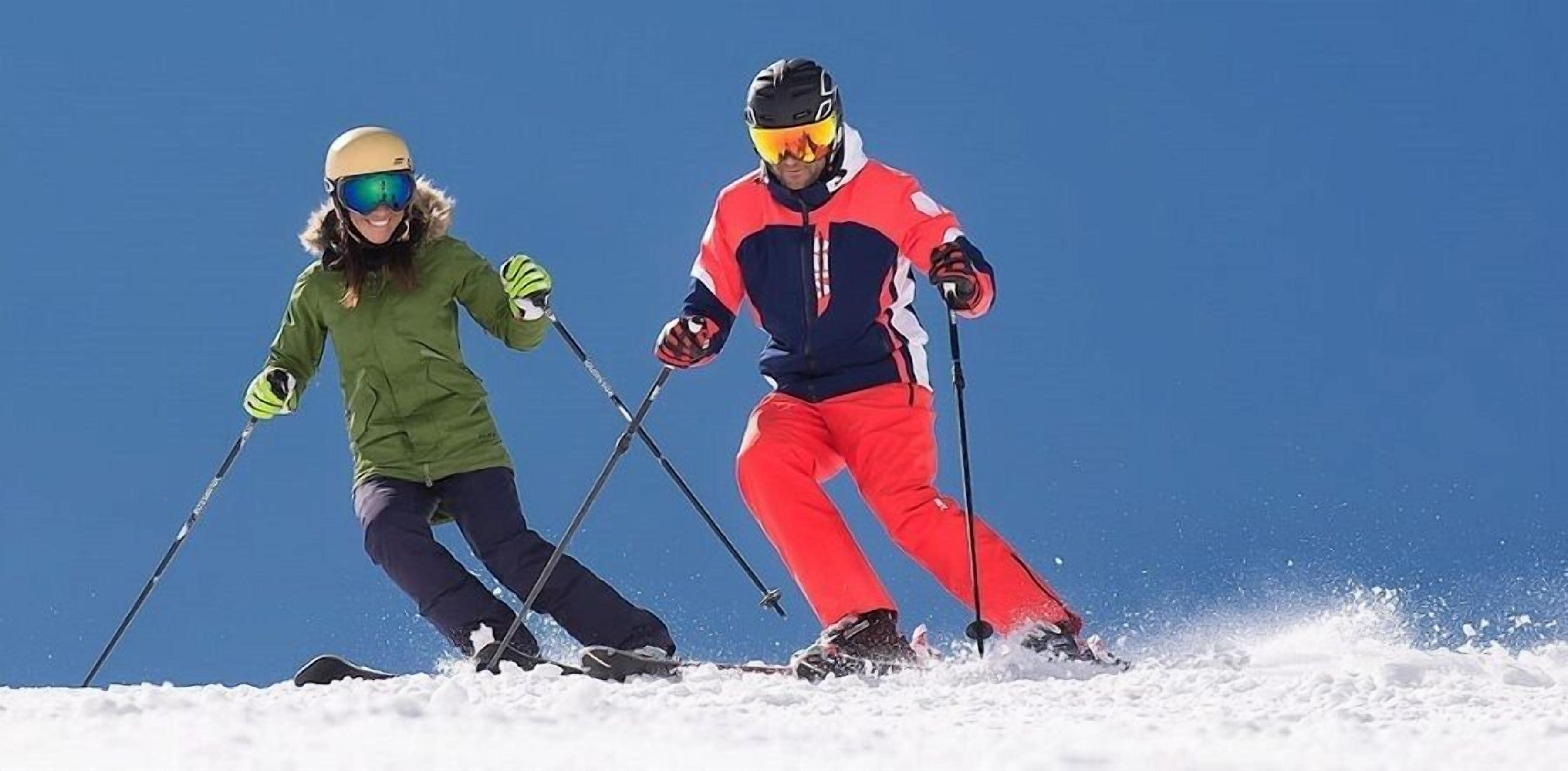 Two skiers on a snowy slope.