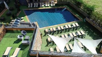 Seasonal outdoor pool, open 10 AM to 6:30 PM, pool umbrellas
