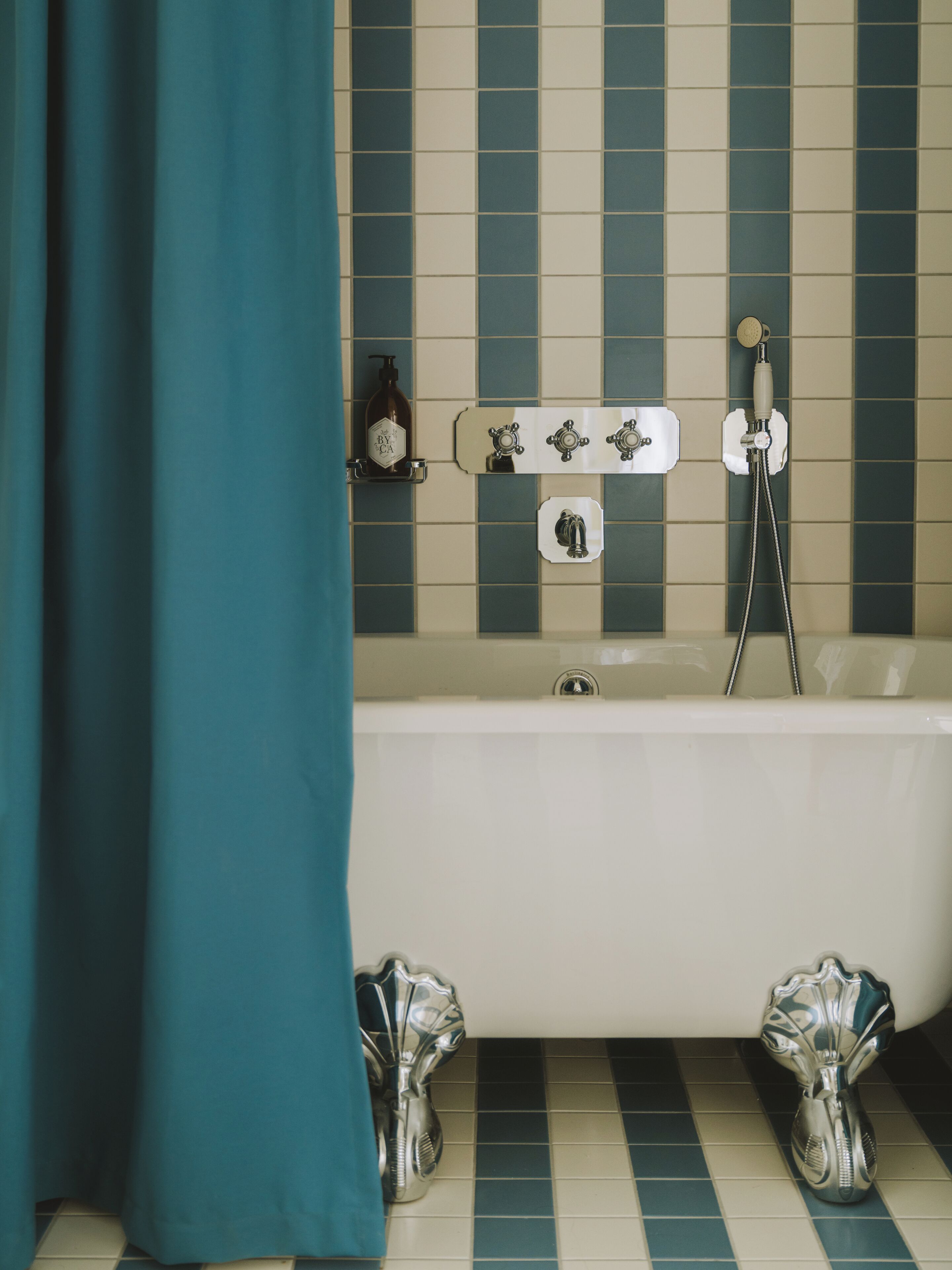 A bathroom with a bathtub, a shower, and a toilet.