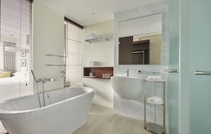 Combined shower/bathtub, deep-soaking bathtub, bathrobes, towels