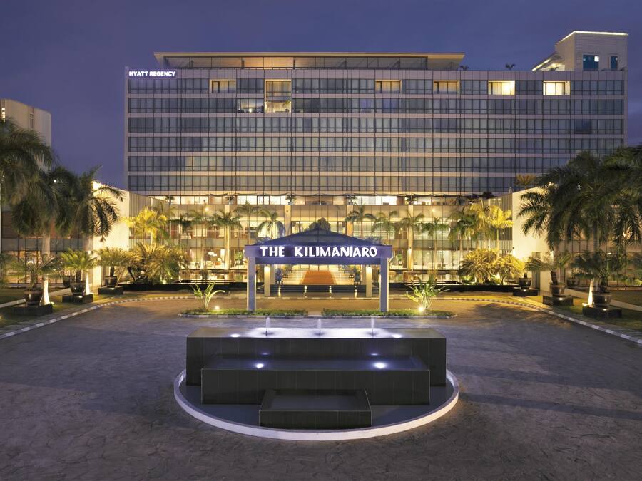 A modern hotel with a prominent entrance labeled "The Kilimanjaro."