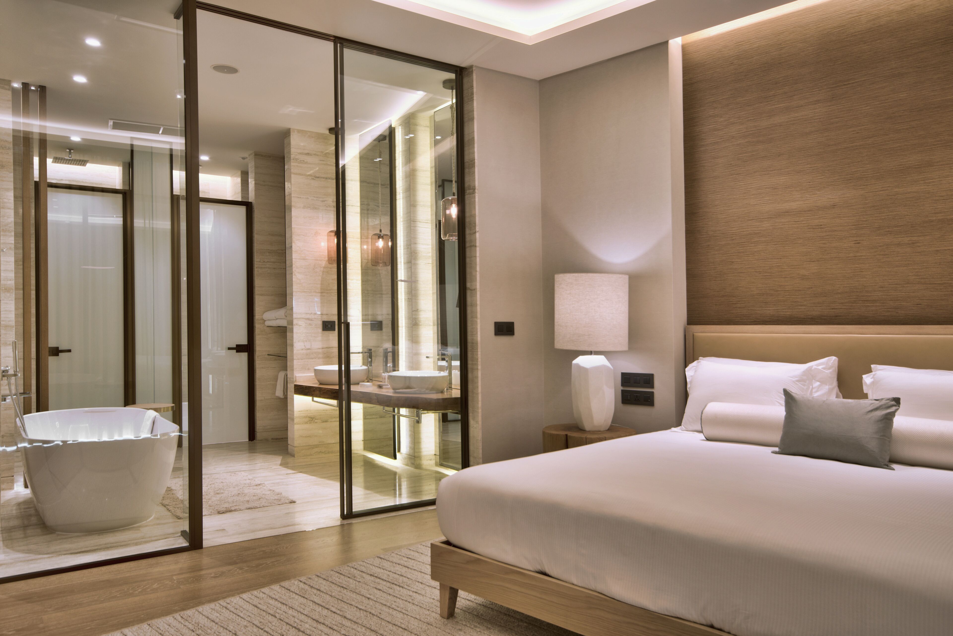 deep-soaking bathtub, designer toiletries, hair dryer, bathrobes