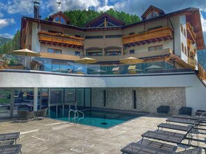 Indoor pool, seasonal outdoor pool, pool umbrellas, pool loungers