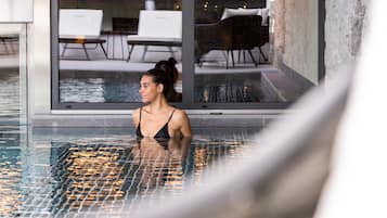 Indoor pool, seasonal outdoor pool, pool umbrellas, pool loungers
