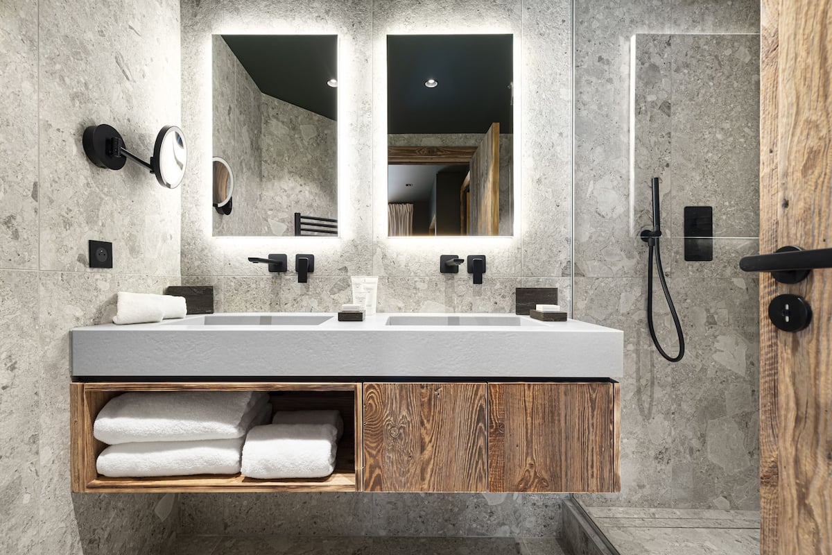 designer toiletries, hair dryer, bathrobes, slippers