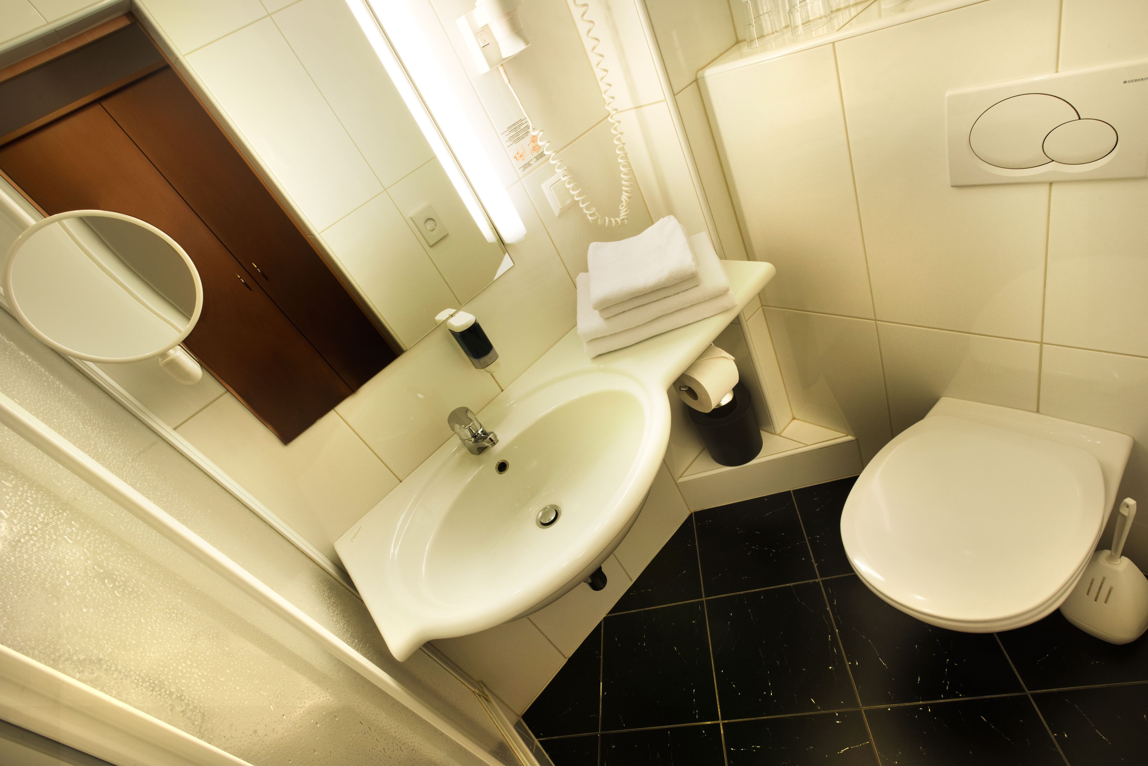 eco-friendly toiletries, hair dryer, towels