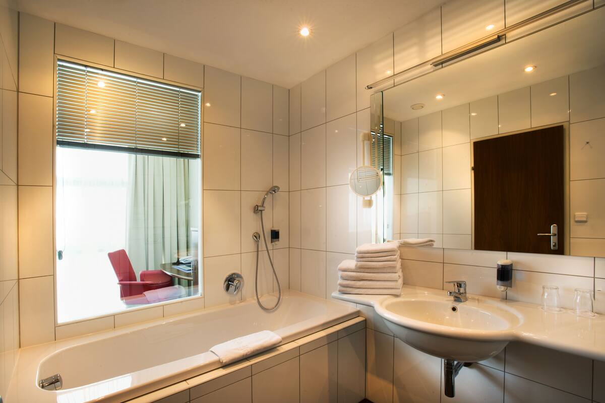 superior double room | bathroom | eco-friendly toiletries, hair dryer, towels