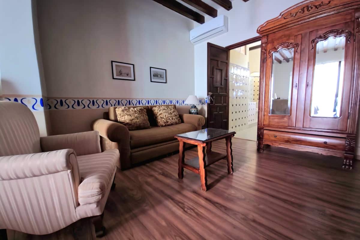 grand studio suite, balcony | living area | led tv