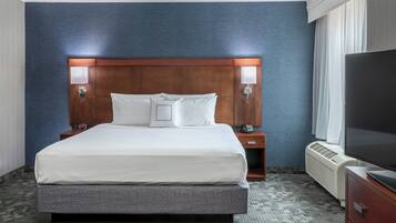 Desk, laptop workspace, blackout drapes, iron/ironing board