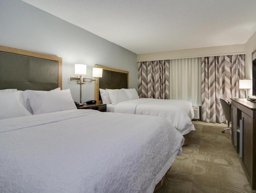 Premium bedding, pillow-top beds, desk, laptop workspace